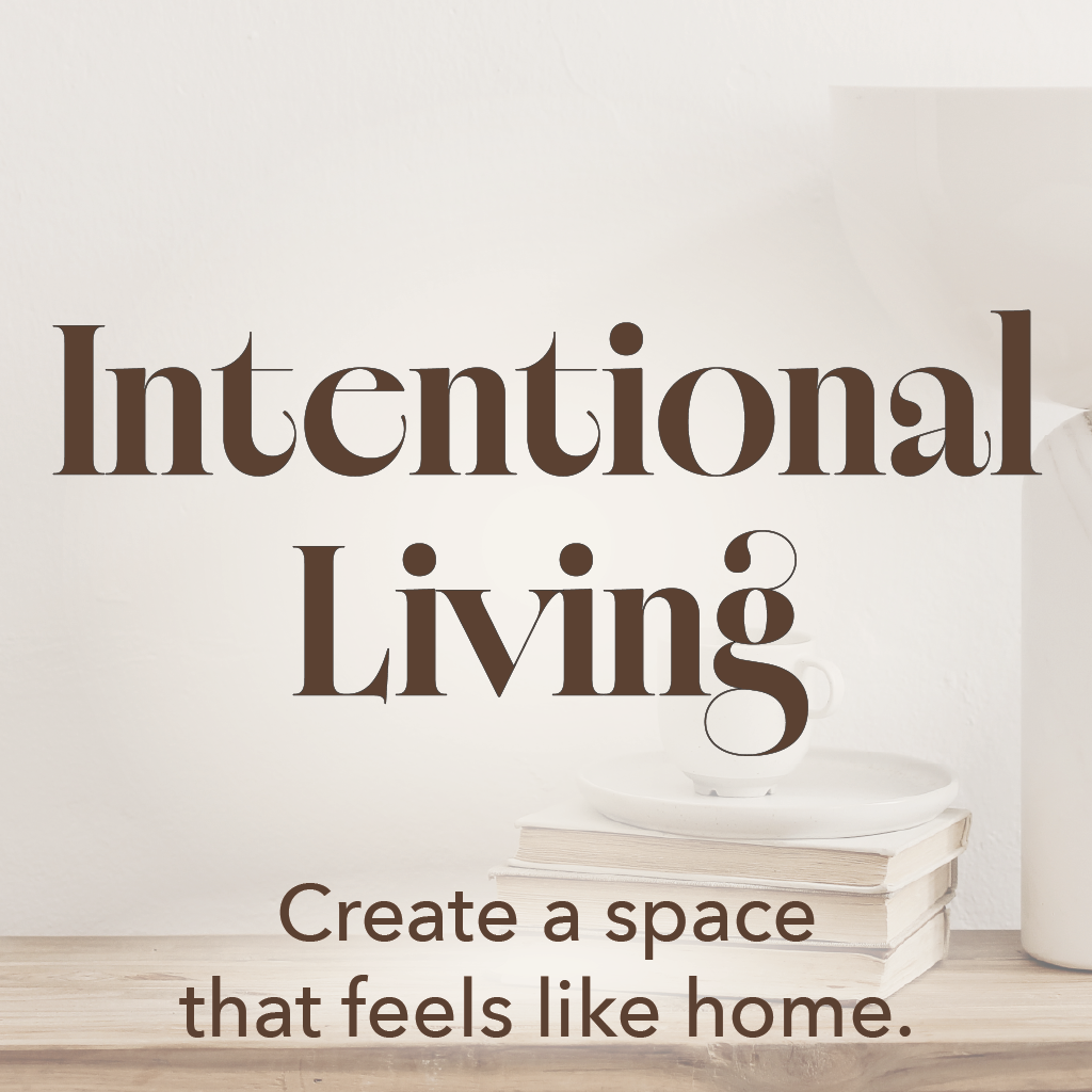 Intentional Living category image showing cozy home decor with stacked books, neutral ceramics, and warm minimalist interior styling.